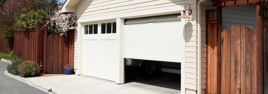 Fix Metal Garage Door Jerking in Whitby, Ontario